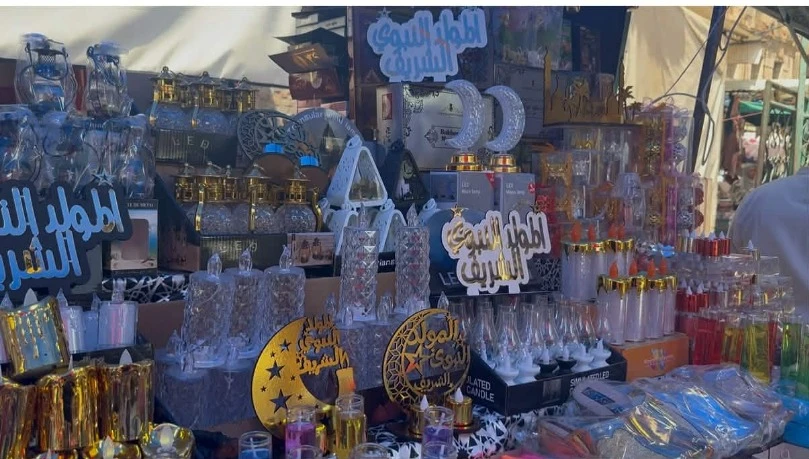 المدينة الجديدة تستعد  للاحتفال بالمولد  النبوي الشريف .. الشموع ولوازم الحلويات تتصدر واجهات المحلات